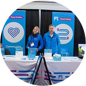 Road Safety and Community Coordinators at an ICBC booth.